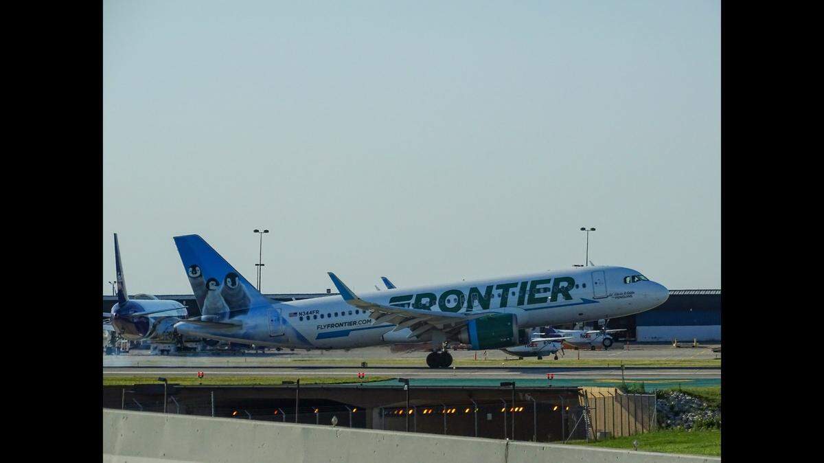 A 60-year-old Frontier Airlines passenger is accused of pulling down her pants and threatening to pee in the aisle of a flight from Orlando to Philadelphia.