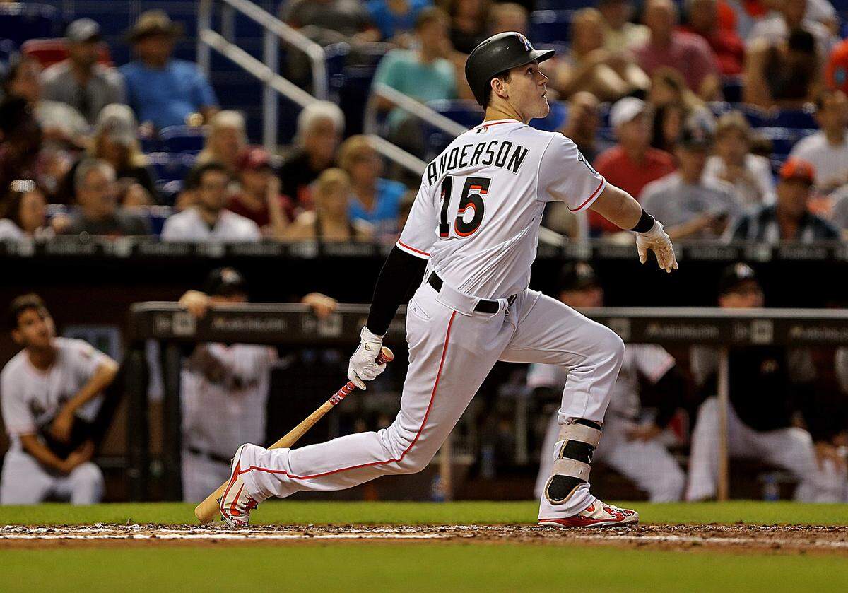 The Marlins #15 Brian Anderson hits a single in the third inning as the Miami Marlins host their final home game of the season against the Cincinnati Reds on Sunday, September 23, 2018.