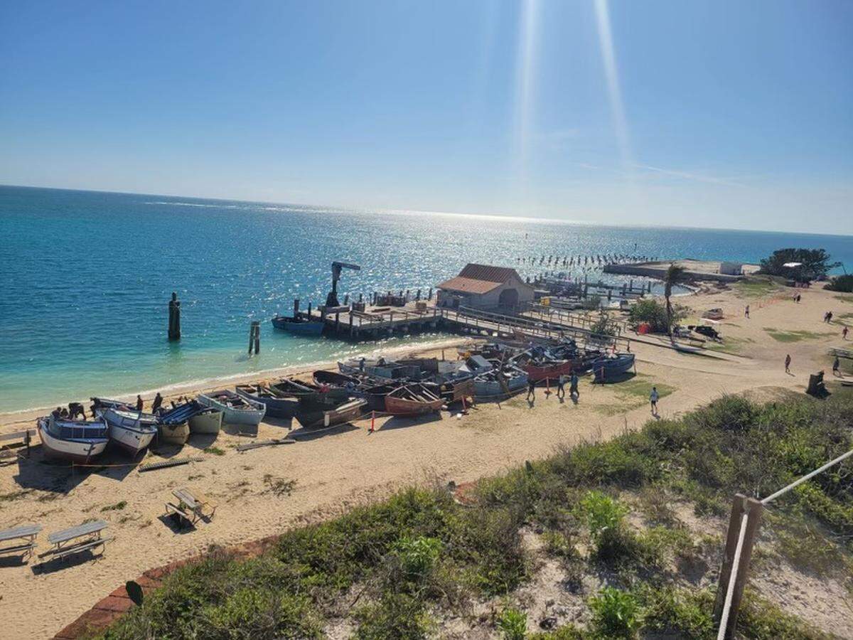 A fleet of migrant boats line the beach of Garden Key, home to Fort Jefferson in the Dry Tortugas National Park. The National Park Service closed the Tortugas Sunday, Jan. 1, 2022, after almost 500 Cuban migrants arrived there over the course of several days.