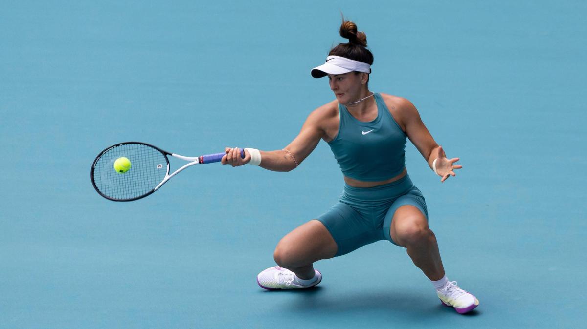 Bianca Andreescu of Canada returns a shot to Emma Raducanu of the United Kingdom during their match at the Miami Open tennis tournament on Wednesday, March 22, 2023, in Miami Gardens, Fla.