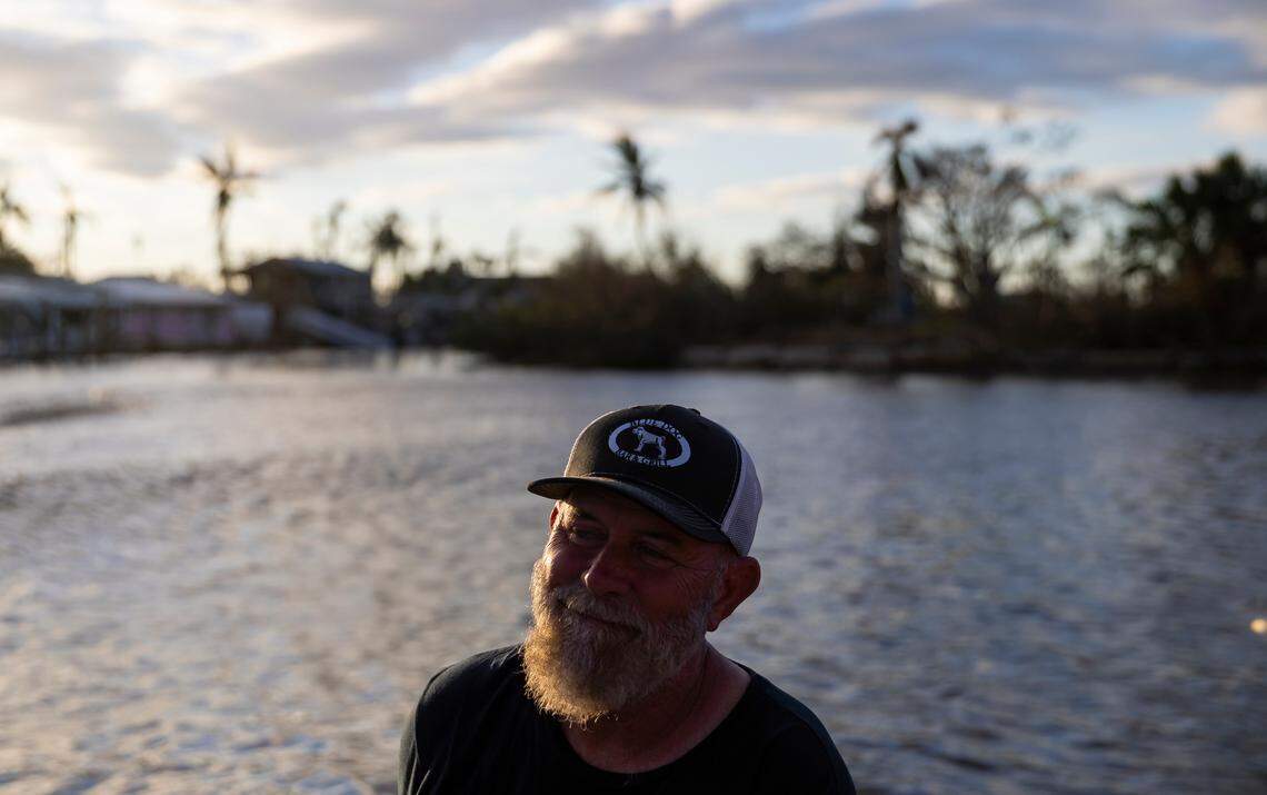 John Lynch, 59, the owner of Blue Dog Bar & Grill, is ferried off Matlacha by firefighters on Thursday, Sept. 29, 2022, in Matlacha, Fla. Hurricane Ian made landfall on the coast of Southwest Florida as a Category 4 storm Wednesday afternoon, leaving areas affected with flooded streets, downed trees and scattered debris.
