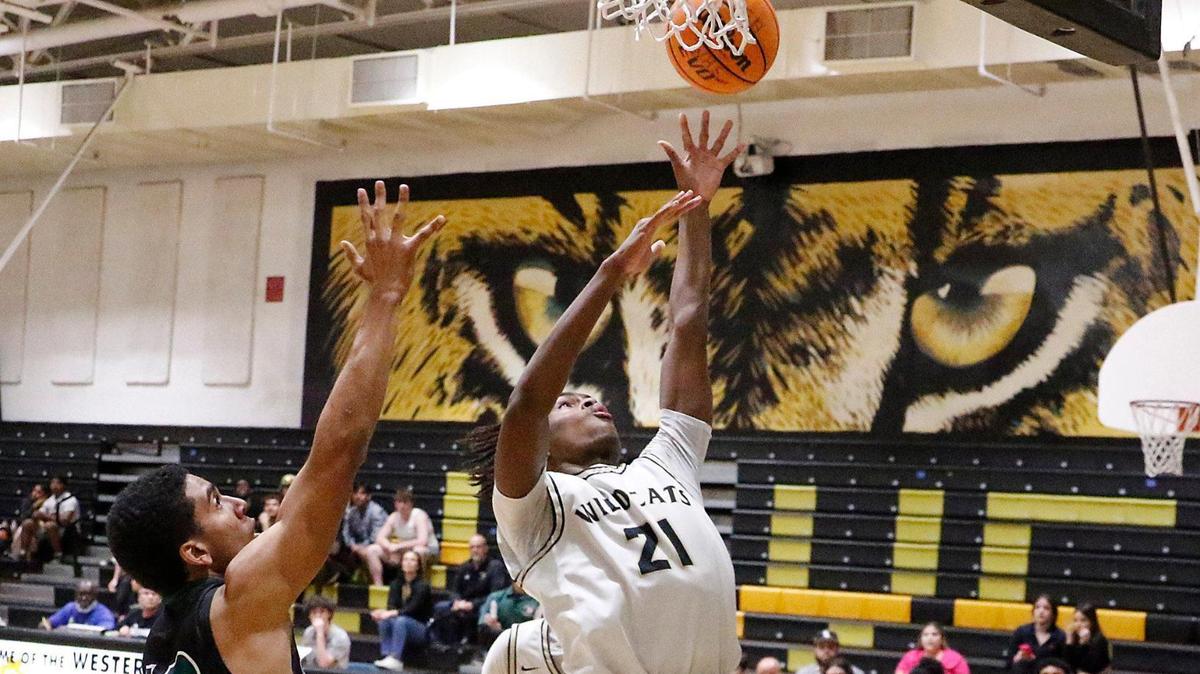 Western Wildcats Ethan Panton-Hazell (21) shoots against Hialeah Gardens Gladiators during Region 4-7A boys basketball quarterfinal game on Thursday, February 15, 2024 at Western HS in Davie.