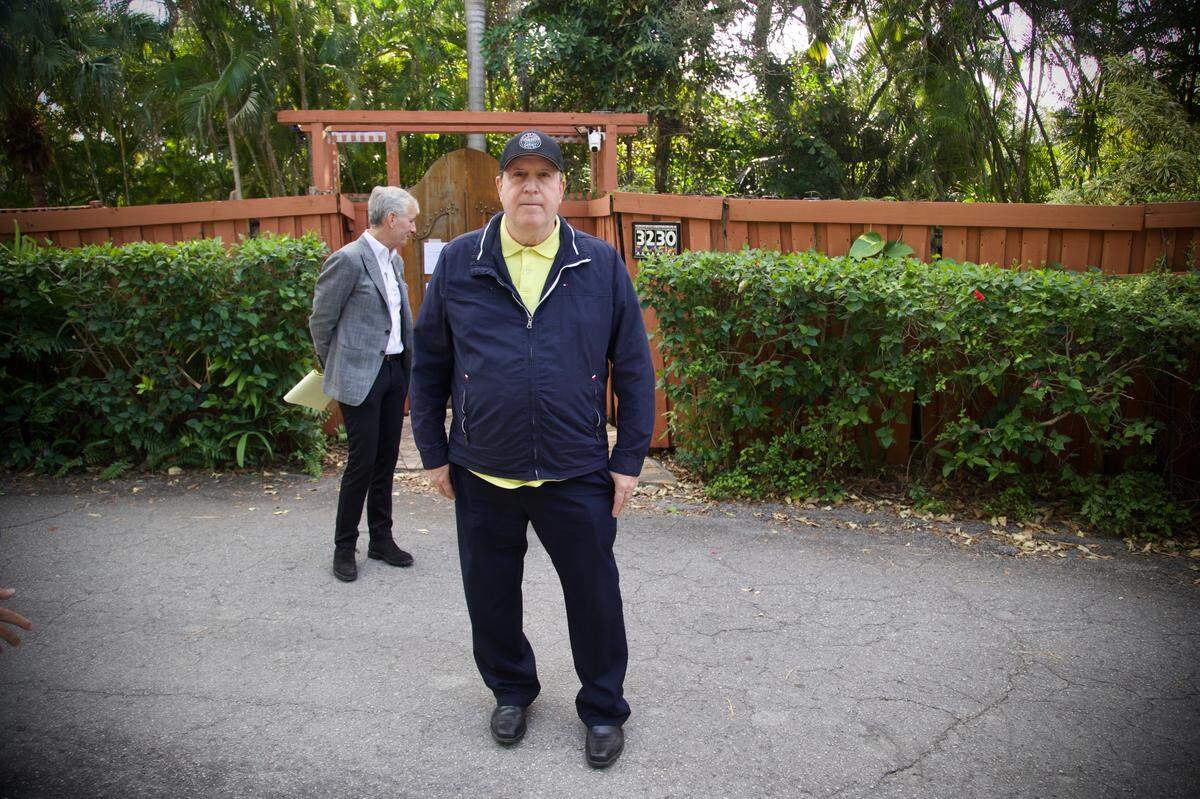 Miami Commissioner Joe Carollo comes out of his house to talk to reporters in front of his residence in Coconut Grove on Friday, Feb. 2, 2024. U.S. Marshals moved to seize Carollo’s property after he lost a federal civil trial where he was accused of misusing his public office.