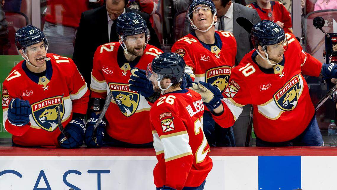 Florida Panthers defenseman Uvis Balinskis (26) celebrates with teammates on the bench during the second period of an NHL game against the St. Louis Blues at Amerant Bank Arena on Friday, Dec. 20, 2024, in Sunrise, Fla.