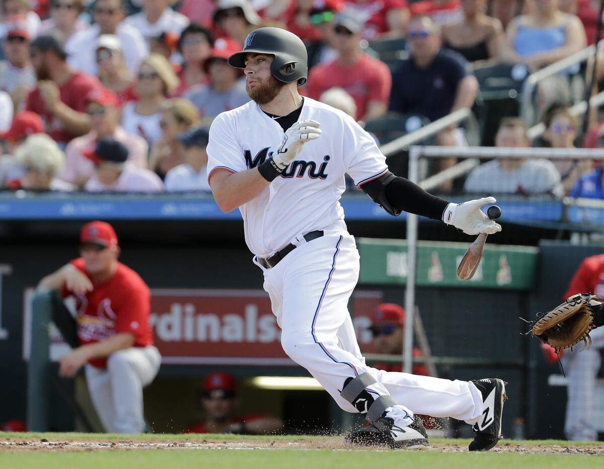 Miami Marlins’ Austin Dean bats during the third inning of an exhibition spring training baseball game against the St. Louis Cardinals Saturday, Feb. 23, 2019, in Jupiter, Fla. (AP Photo/Jeff Roberson)