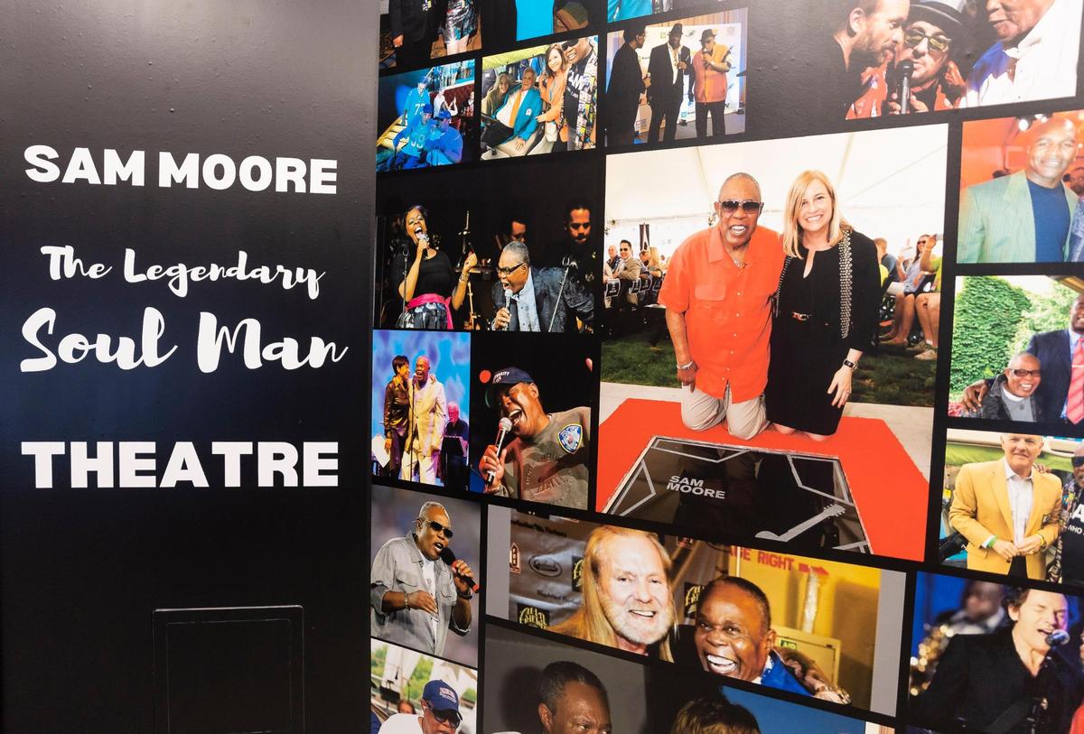 Photos of American singer Sam Moore alongside celebrities and friends are seen inside the Lee Caplin School of Journalism & Media at Florida International University Biscayne Bay Campus on Friday, Nov. 17, 2023, in North Miami, Fla.