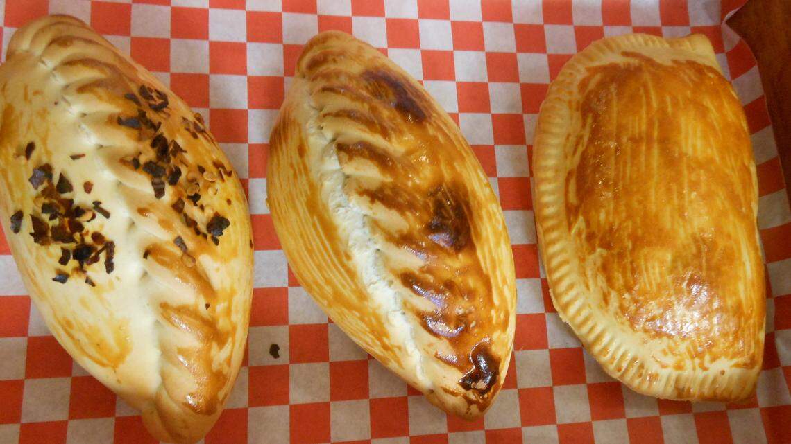 Baked saltenas, Bolivian-style empanadas, brushed with an egg wash before going in the oven for a golden glaze at Top Notch Bistro.