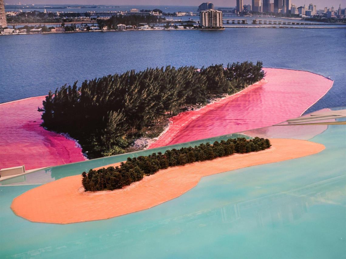 A scale model of one of the covered islands from 1983 is juxtaposed next to a large photograph of the actual conceptual art installation, “Surrounded Islands,” which involved surrounding eleven man-made islands in Biscayne Bay with pink fabric.