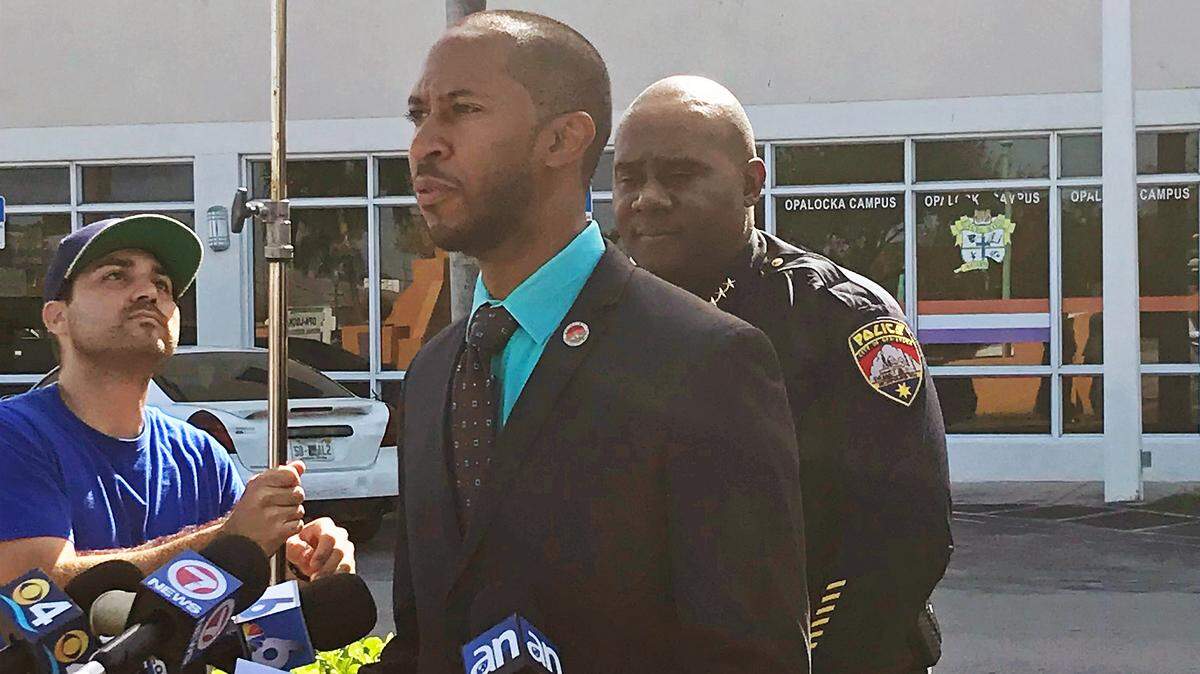 Opa-locka Mayor Matthew Pigatt and Police Chief James Dobson announced during a press conference Wednesday that an Opa-locka police officer who entered an apartment last week without permission or a warrant while searching for a suspected gunman, had been suspended.