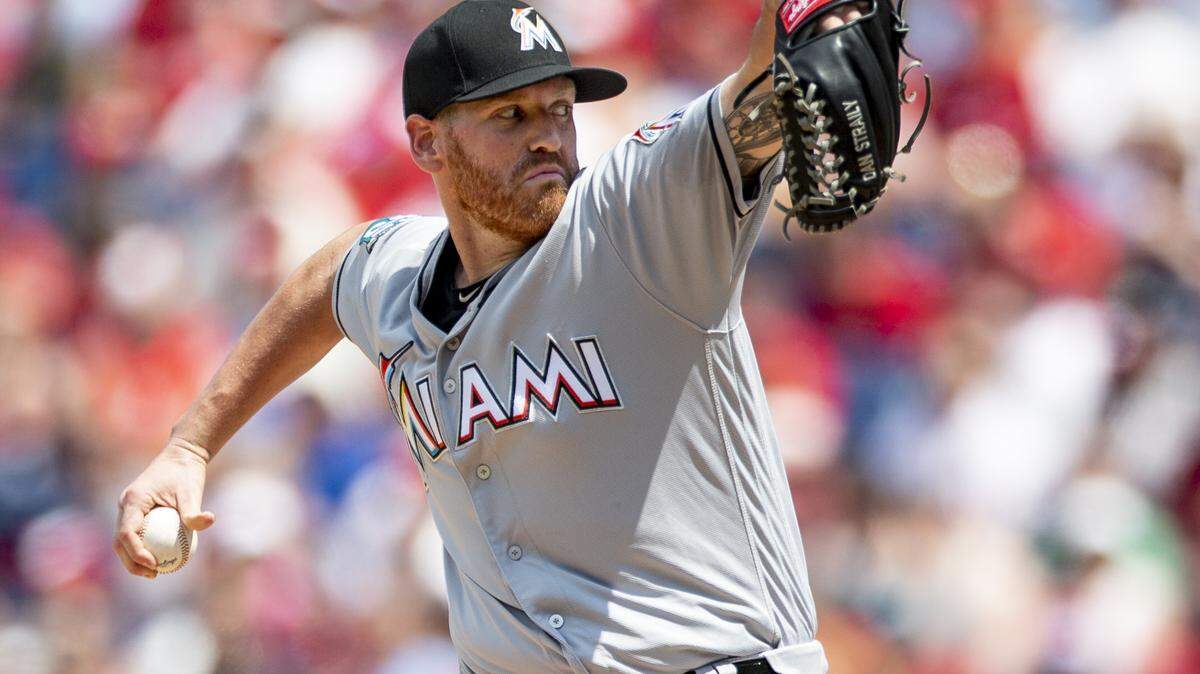 Miami Marlins starting pitcher Dan Straily throws during the first inning of a baseball game against the Philadelphia Phillies, Sunday, Aug. 5, 2018, in Philadelphia. (AP Photo/Laurence Kesterson)