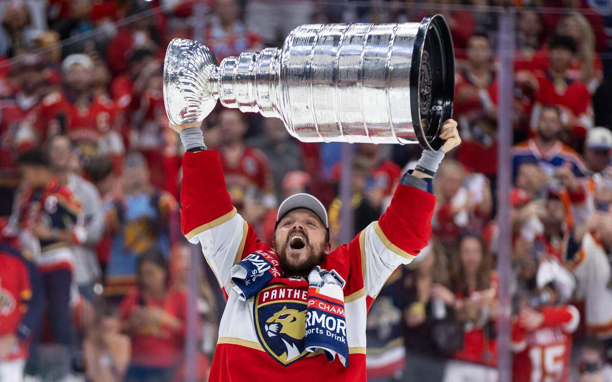 Florida Panthers center Sam Reinhart (13) reacts while lifting the Stanley Cup after defeating the Edmonton Oilers in Game 7 of the Stanley Cup Final at Amerant Bank Arena on Monday, June 24, 2024, in Sunrise, Fla.