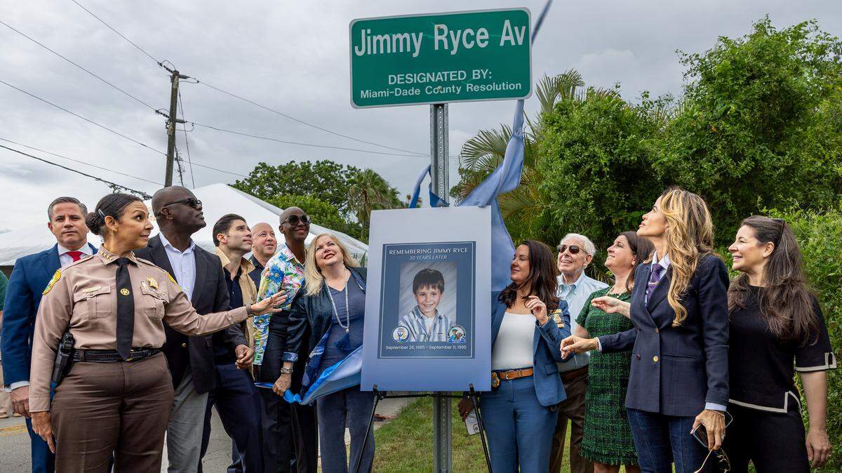 Dignitaries, including Miami-Dade Sheriff Rosie Cordero-Stutz and Miami-Dade County Commissioner Danielle Cohen Higgins, unveil Jimmy Ryce Avenue at the intersection of Southwest 162nd Avenue and 232nd Street in Redland on Friday, June 5, 2026. 