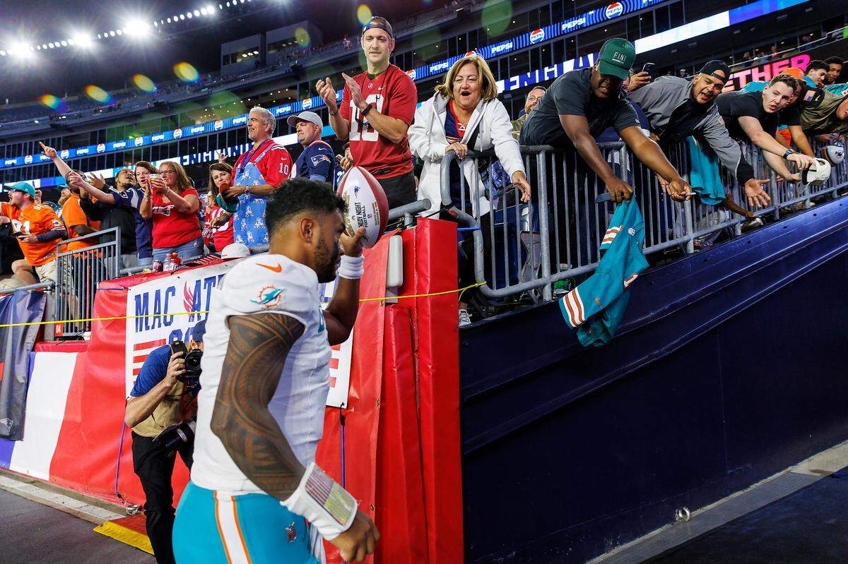 Miami Dolphins quarterback Tua Tagovailoa (1) greets the fans after the Dolphins 24-17 win over the New England Patriots during an NFL football game at Gillette Stadium on Sunday, Sept. 17, 2023 in Foxborough, MA.