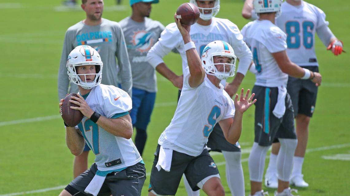 Miami Dolphins quarterbacks Ryan Tannehill #17 David  Fales, #9 and Brock Osweiler #8 running  drills during the Miami Dolphins Organized Team Activities at the Baptist Health Training Facility at Nova Southeastern University on Wednesday, May 23, 2018 in Davie.