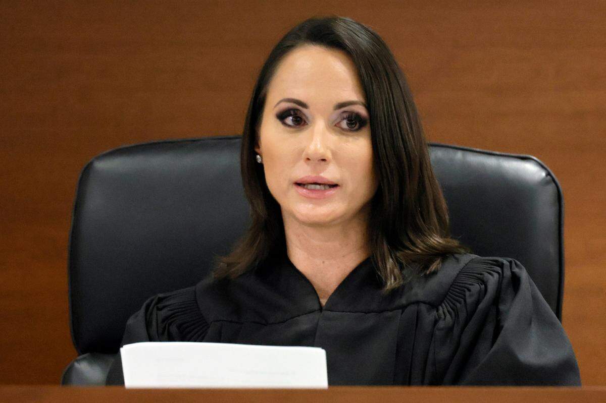 Judge Elizabeth Scherer reads the verdict in the trial of Marjory Stoneman Douglas High School shooter Nikolas Cruz at the Broward County Courthouse in Fort Lauderdale on Thursday, Oct. 13, 2022. Cruz, who plead guilty to 17 counts of premeditated murder in the 2018 shootings, is the most lethal mass shooter to stand trial in the U.S. He was previously sentenced to 17 consecutive life sentences without the possibility of parole for 17 additional counts of attempted murder for the students he injured that day. (Amy Beth Bennett/South Florida Sun Sentinel via AP, Pool)