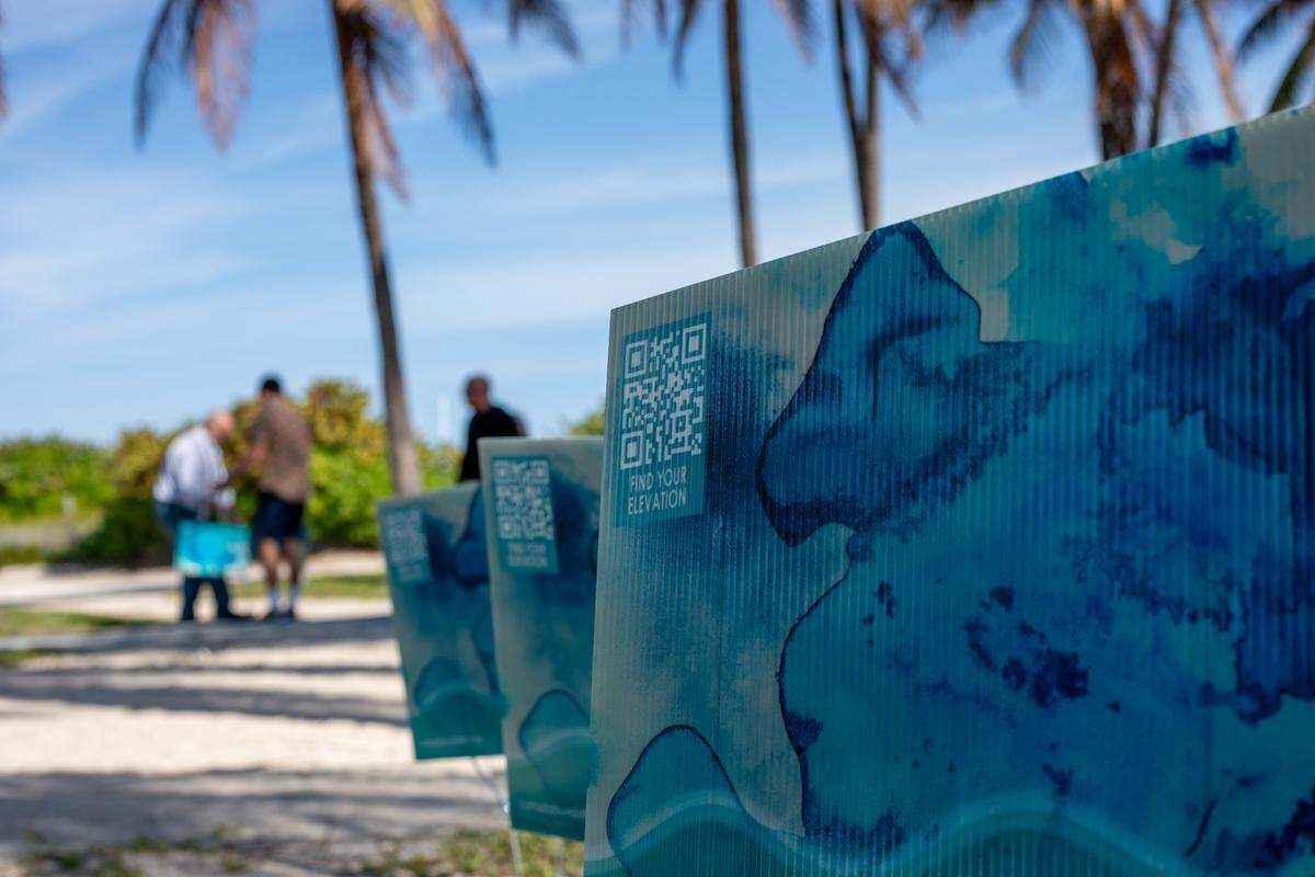 QR codes on the yard signs lead to a website to find the elevation above sea level of an address.