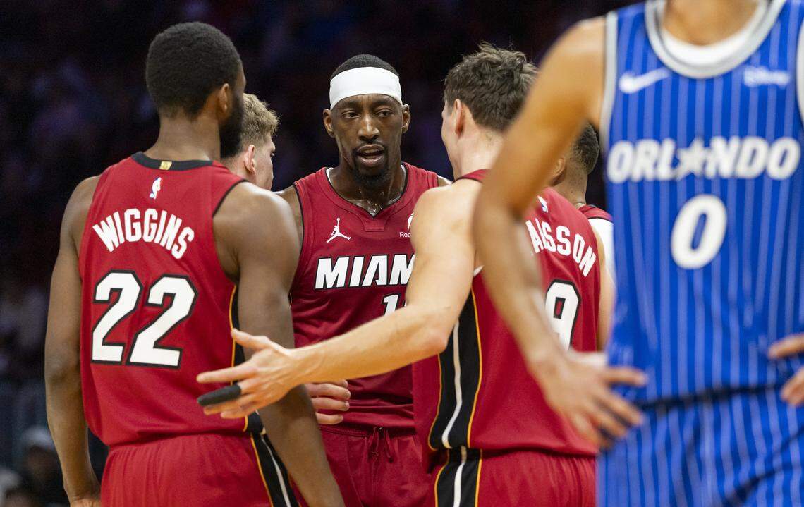 Miami Heat center Bam Adebayo (13) huddles with his teammates as they play against the Orlando Magic in the first half of their NBA game at Kaseya Center on Jan. 28, 2026, in Miami.