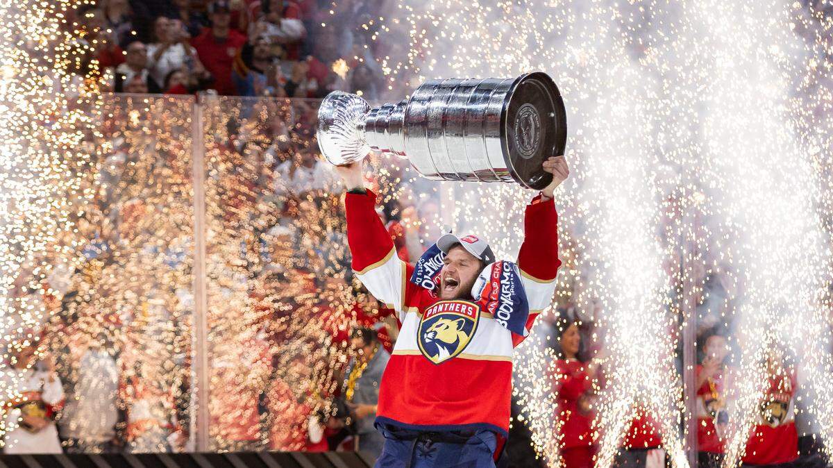 Florida Panthers center Aleksander Barkov (16) lifts the Stanley Cup after defeating the Edmonton Oilers in Game 7 of the Stanley Cup Final at Amerant Bank Arena on Monday, June 24, 2024, in Sunrise, Fla.