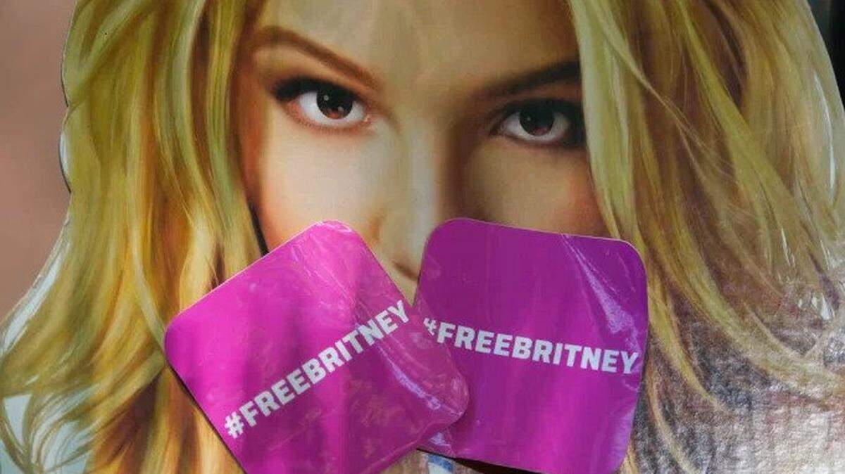 Stickers in support of Britney Spears’ fight to end her father’s conservatorship adorn a poster of the singer.