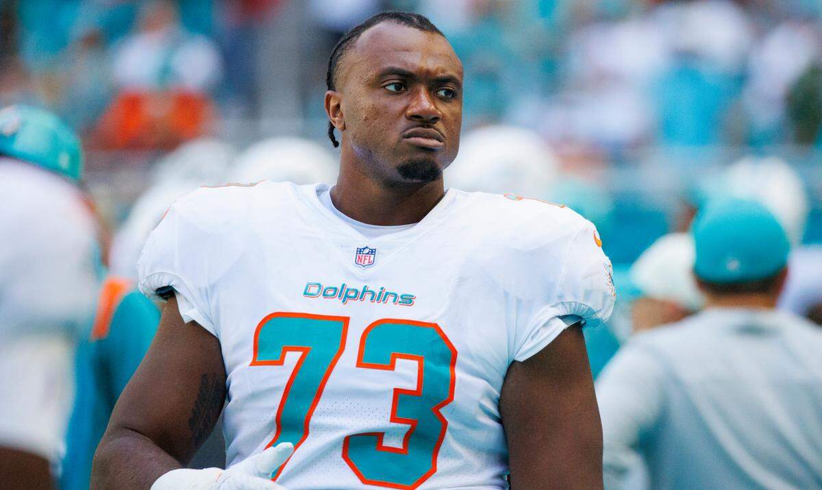 Miami Dolphins guard Austin Jackson (73) looks from the sidelines during fourth quarter of an NFL football game against the New England Patriots at Hard Rock Stadium on Sunday, September 11, 2022 in Miami Gardens, Florida.