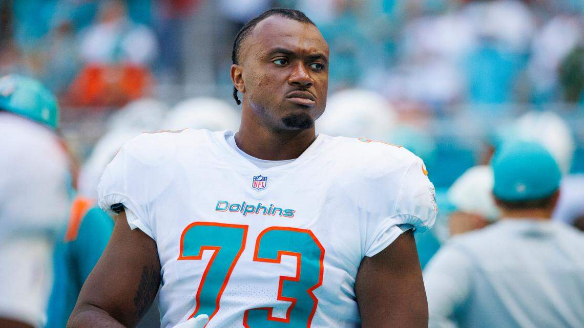 Miami Dolphins guard Austin Jackson (73) looks from the sidelines during fourth quarter of an NFL football game against the New England Patriots at Hard Rock Stadium on Sunday, September 11, 2022 in Miami Gardens, Florida.