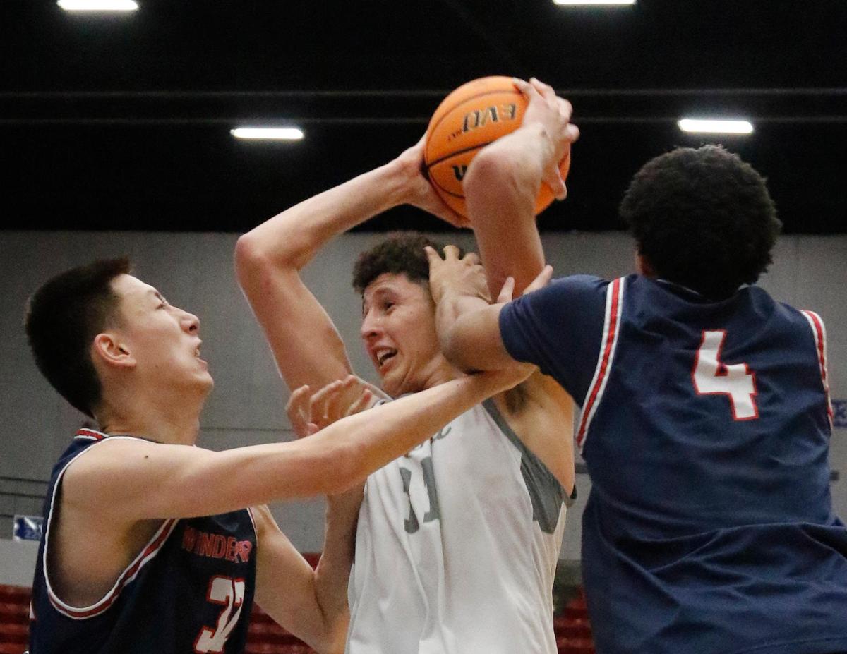 Bulldogs #11 Gustavo Guimaraes Alves draws a foul Lakers 32 Sinan Luan (L) and #4Malachi Martis on a drive to the basket in the first half. Riviera Prep defeated the Windermere Prep 68 to 57 to earn back to back state titles. Fhsaa 2024 State Championships Lakeland, Fl. March 1st 2024. Special to the Gainesville Sun/ Calvin Knight.