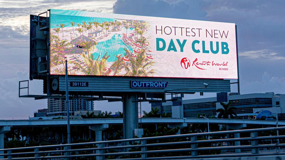 An electronic advertisement at the former Miami Herald site promoting current owner Genting’s Bimini resort as seen from the MacArthur Causeway in Miami on June 22, 2021. Miami-Dade County commissioners voted to loosen billboard rules by allowing more roadside ads and digital billboards.