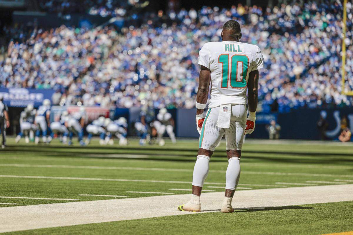 Miami Dolphins wide receiver Tyreek Hill (10) watches the game from the sidelines late in the fourth quarter during an NFL game against the Indianapolis Colts at Lucas Oil Stadium in Indianapolis on Sunday, September 7, 2025.