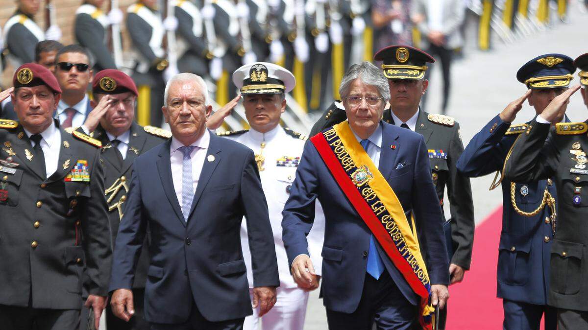 Guillermo Lasso, right, president of Ecuador, walks with Luis Lara, defense minister, to deliver his State of the Nation address, in Quito on May 25, 2023. 
