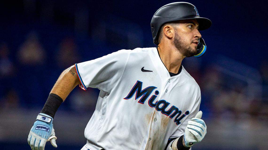 Miami Marlins base runner Jordan Groshans (65) runs to first base after hitting a single on a line drive to center field during the seventh inning of an MLB game against the Philadelphia Phillies at loanDepot park in the Little Havana neighborhood of Miami, Florida, on Wednesday, September 14, 2022.