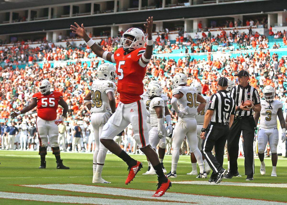 Miami Hurricanes quarterback N’Kosi Perry cheers on the fans after throwing the second touchdown, 14-0, in the second quarter against FIU.