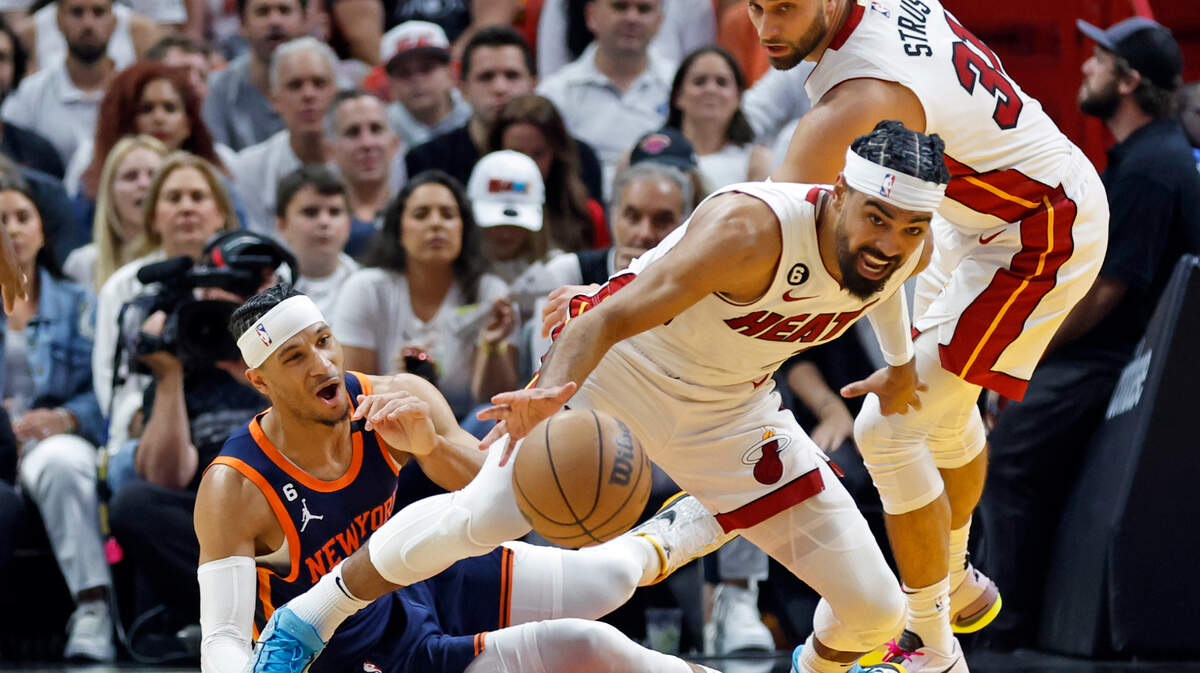 Miami Heat guard Gabe Vincent (2) beats New York Knicks guard Josh Hart (3) for a loose ball in the first quarter during Game 3 of the NBA Eastern Conference Semifinals at the Kaseya Center in Miami on Saturday, May 6, 2023.