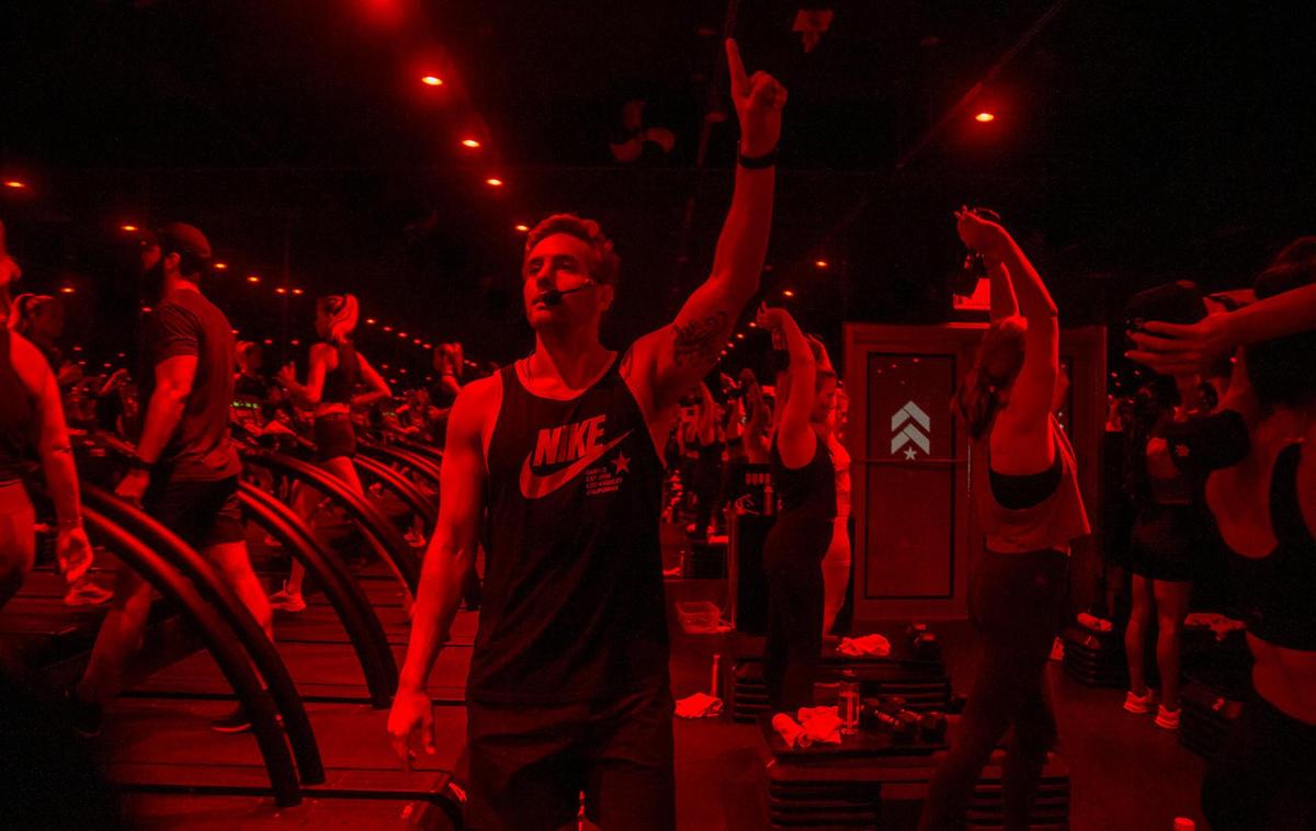 Partner and instructor Derek DeGrazio leads a full fitness class at Barry’s Miami Beach on Friday, August 13, 2021. Gym owners see higher interest in gym memberships compared to before the pandemic.