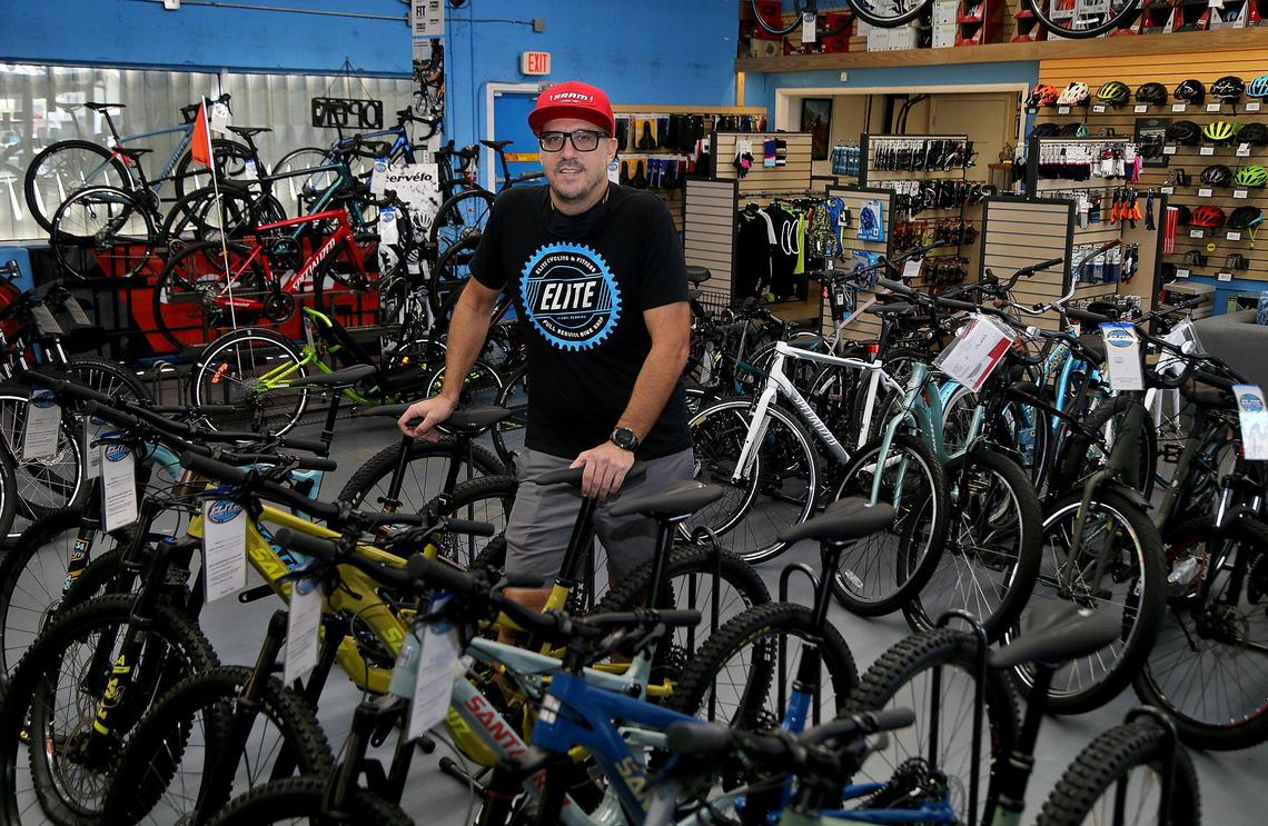 Elite Cycling owner Marcelo Penengo stands in his shop, closed by the coronavirus pandemic. Though customers are not allowed in, the shop is selling and assembling bikes for curbside pickup amid a spike in demand for some types of bicycles during quarantine.