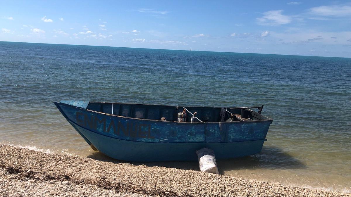 A wooden, homemade boat sits beached on the shores of Key West Tuesday, Aug. 30, 2022. The U.S. Border Patrol said the small vessel carried 24 migrants from Cuba to the Keys.