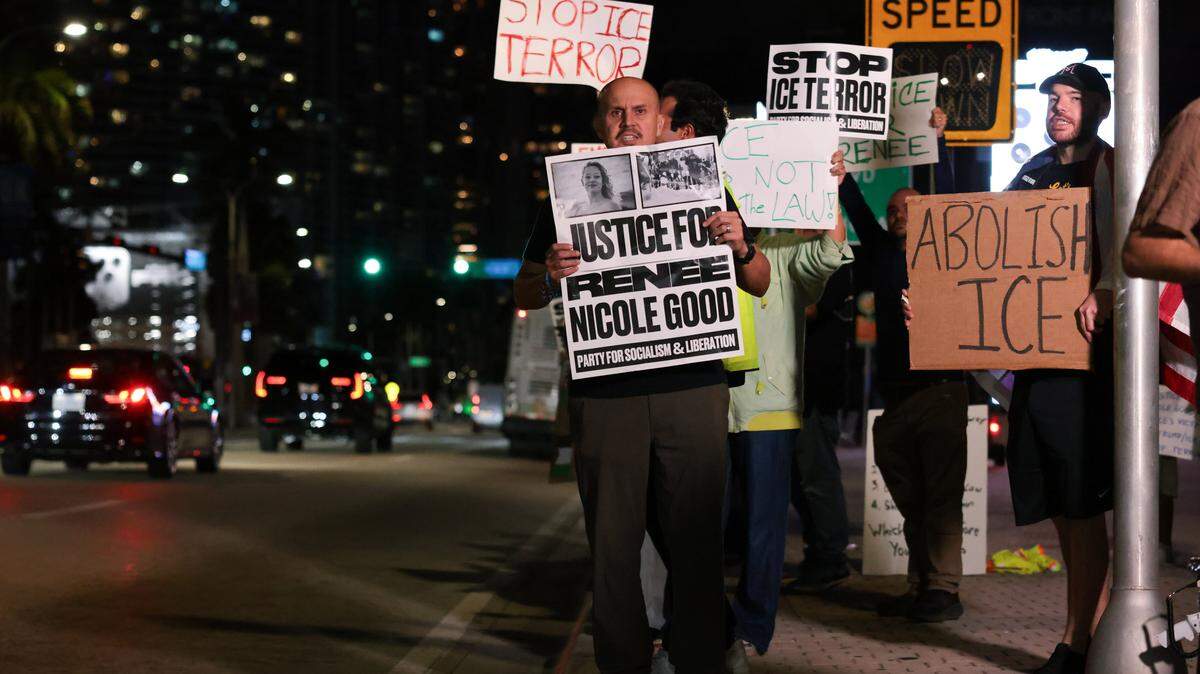 Jim Carles, a former Navy Lieutenant Commander, protests against ICE at the Torch of Friendship monument at 401 Biscayne Blvd., in downtown on Wednesday, Jan. 7, 2026, in Miami.