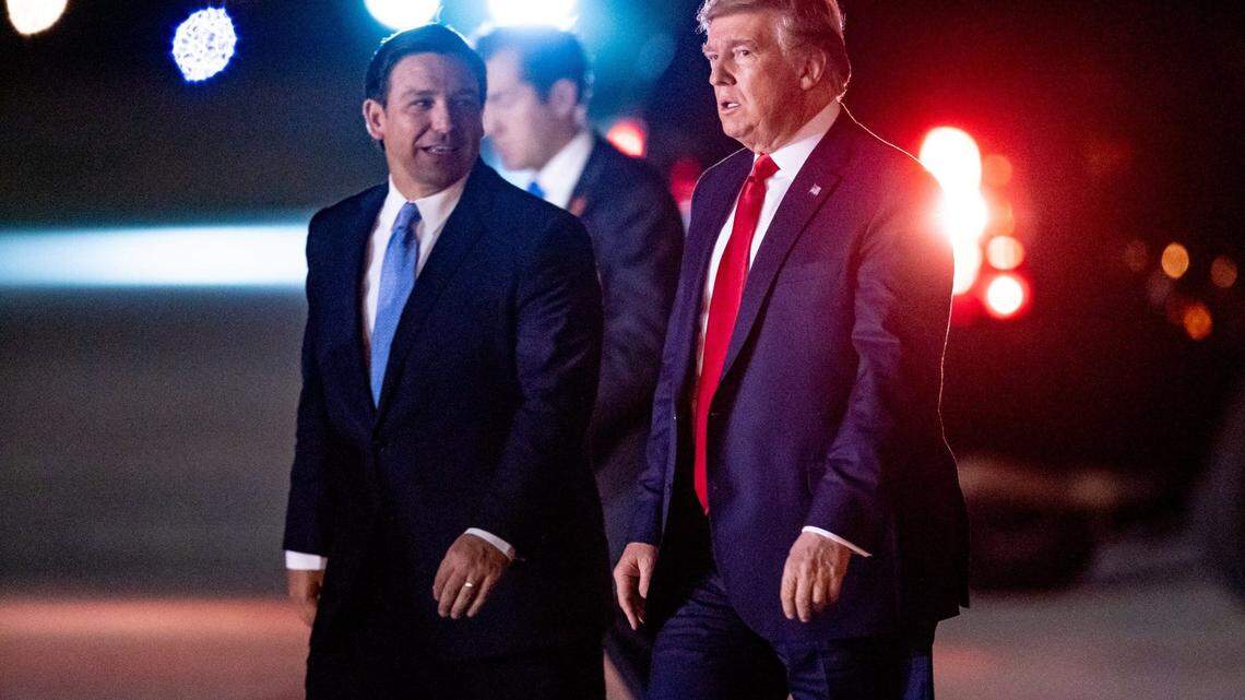President Donald Trump arrives on Air Force One and is greeted by Florida Governor Ron DeSantis at Palm Beach International Airport in West Palm Beach, Fla on Nov. 26, 2019.