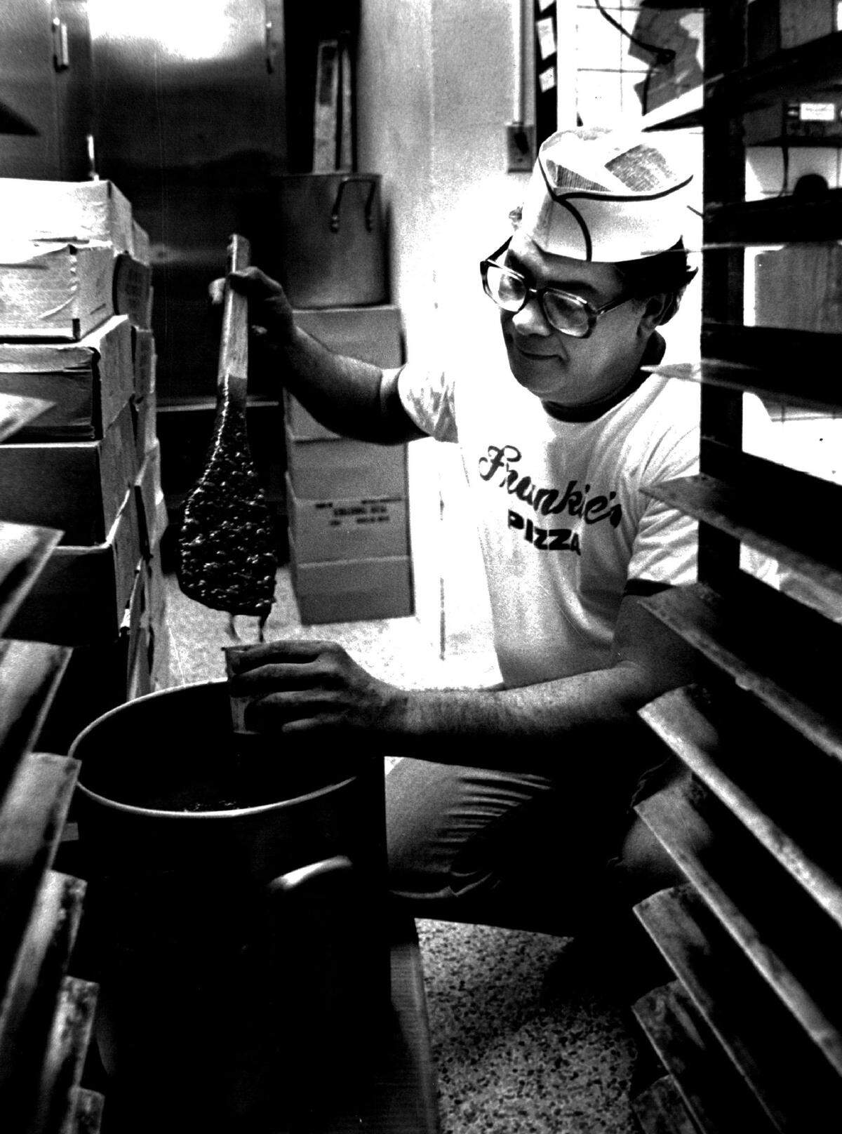 Vic Pasquarella checks the sauce at Frankie’s Pizza in 1981.
