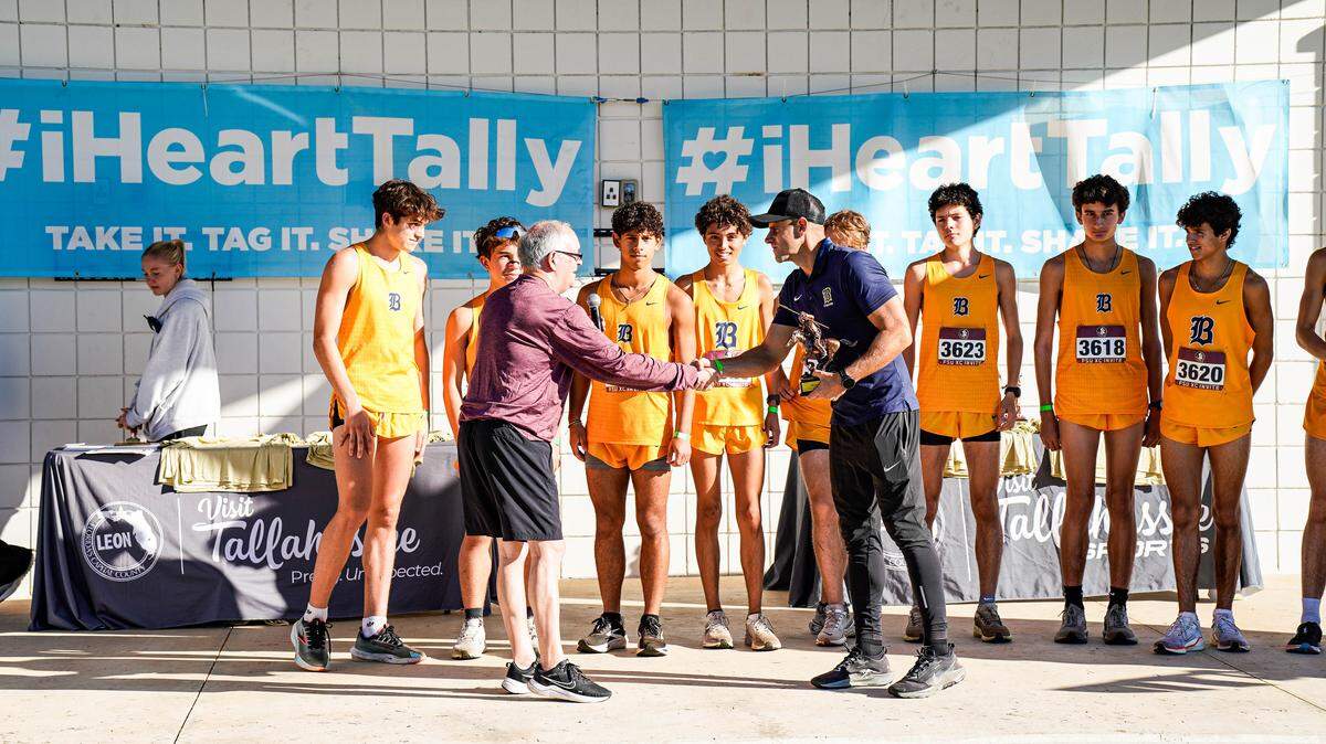 The Belen Jesuit cross-country team accepts its awards after winning the Pre-State Invitational at Apalachee Regional Park in Tallahassee, Fla.