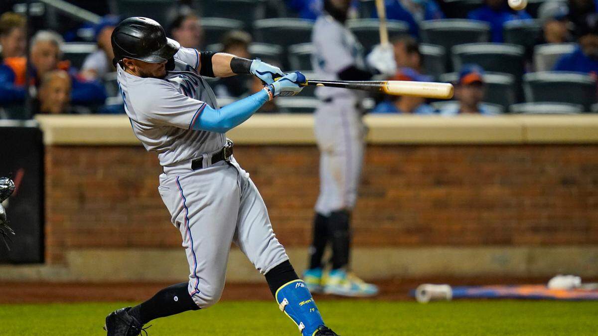 Miami Marlins’ Miguel Rojas hits a two-run single in the eighth inning of a baseball game against the New York Mets, Wednesday, Sept. 29, 2021, in New York. (AP Photo/Frank Franklin II)