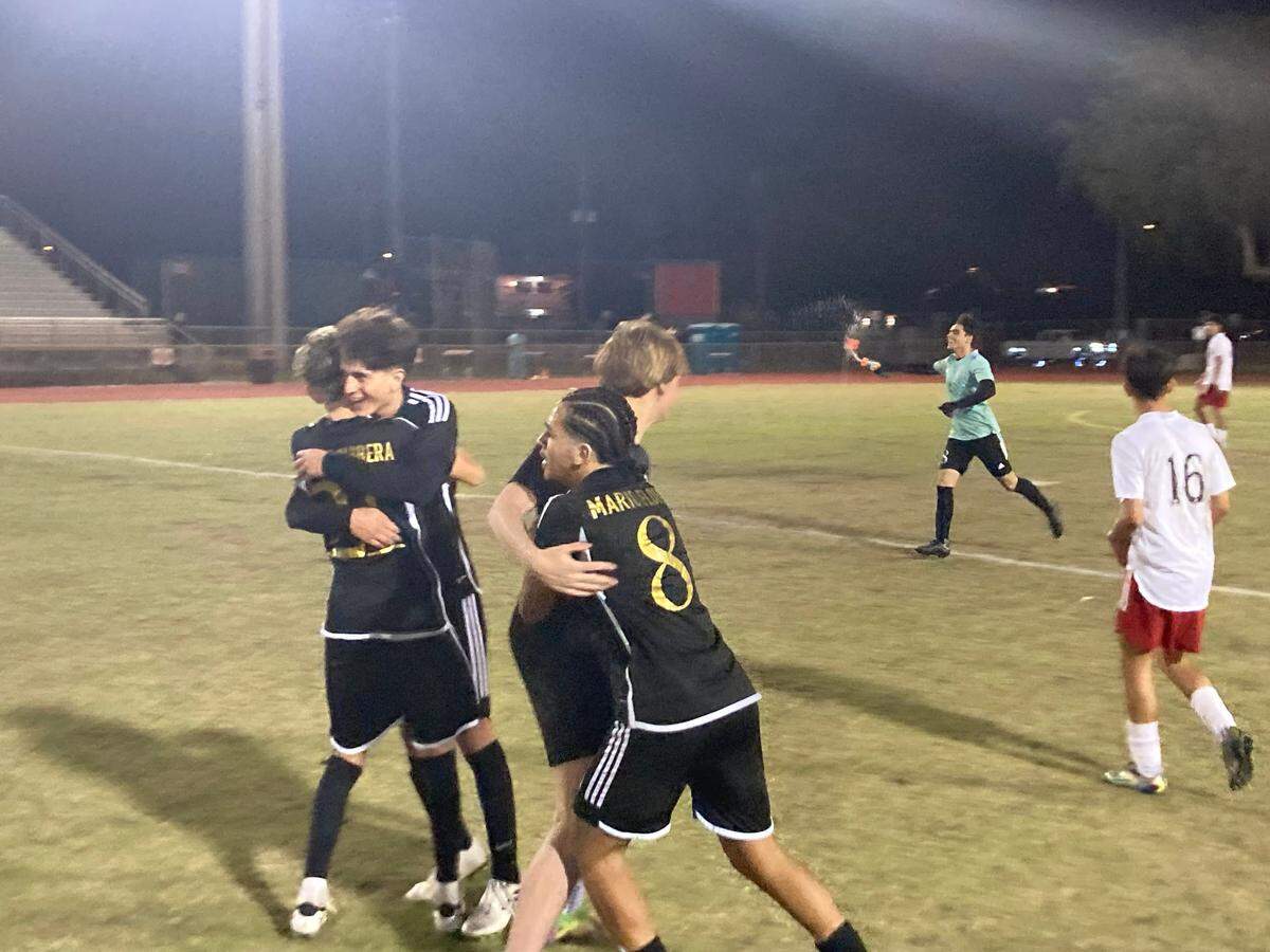 South Broward players celebrate during its 2-0 win over Miami Beach in the Region 4-6A final on Wednesday night at the Bulldogs’ home field.