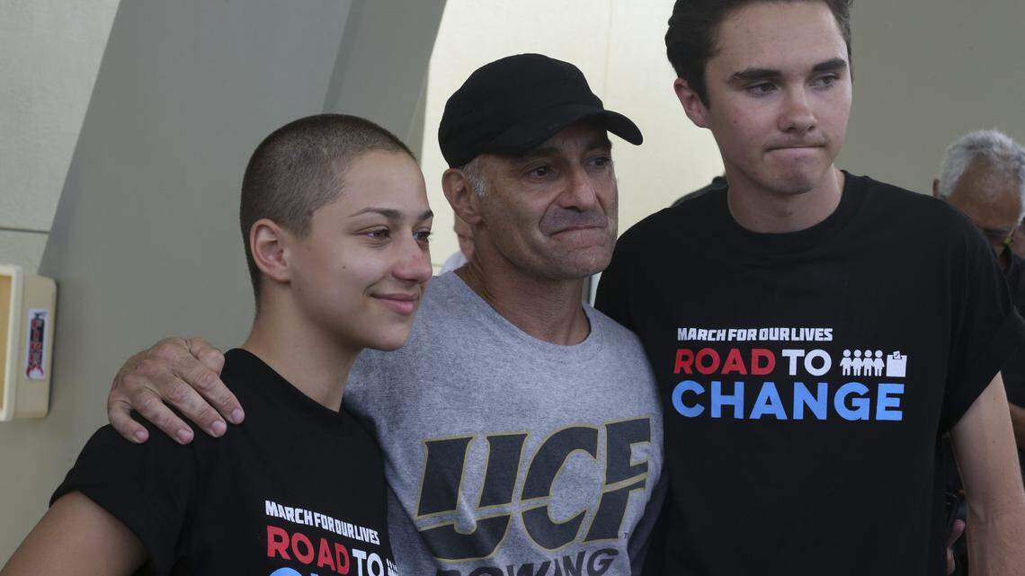 Parkland shooting survivors Emma Gonzalez, left, and David Hogg, far right, pose for a photo with Mitch Dworet, father of Nicholas Dworet, a senior at Marjory Stoneman Douglas High School who was killed during the shooting in February. The newly graduated students, who have become activists, announced plans for a 20-state tour dubbed The March For Our Lives: Road to Change on Monday, June 4, 2018, at the City of Parkland Amphitheater. The group plans to meet with young voters and campaign to end gun violence.