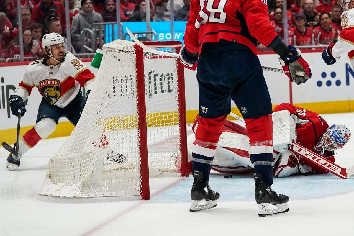 Florida Panthers left wing Ryan Lomberg, left, celebrates his goal past Washington Capitals goaltender Ilya Samsonov (30) during the second period of Game 6 in the first round of the NHL Stanley Cup hockey playoffs, Friday, May 13, 2022, in Washington. (AP Photo/Alex Brandon)