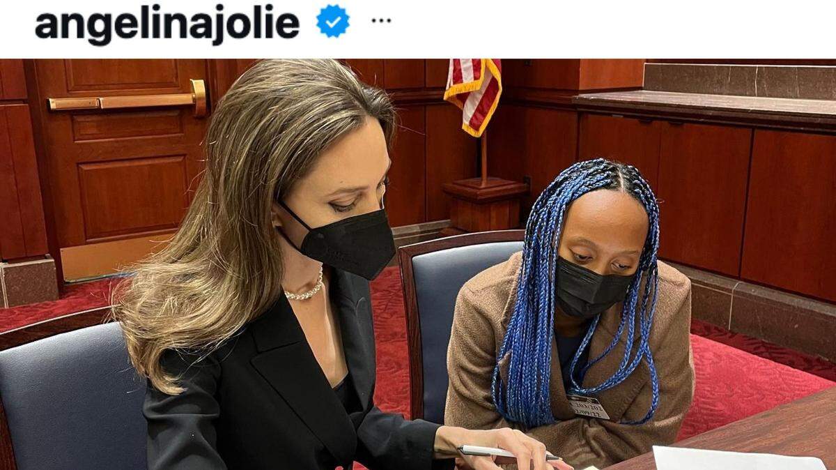 Angelina Jolie and daughter Zahara in a courtroom.