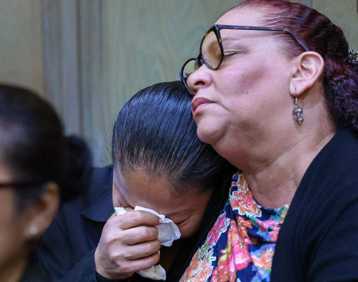 Lindsey Ma, center, the mother of Aaron Vu, is comforted by a supporter as the judge sentences Anthawn Ragan Jr. to life in prison for Aaron's murder during a 2013 robbery at the family's nail salon on Tuesday, March 10, 2026, at the Richard E. Gerstein Justice Building in Miami, Florida.
