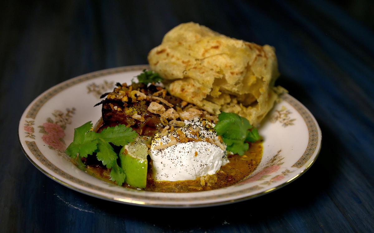A roasted curry calabaza (labneh yogurt, black lime, fried curry leaves) by chef Timon Balloo, from the menu of his new Balloo: Modern Home Cooking restaurant.