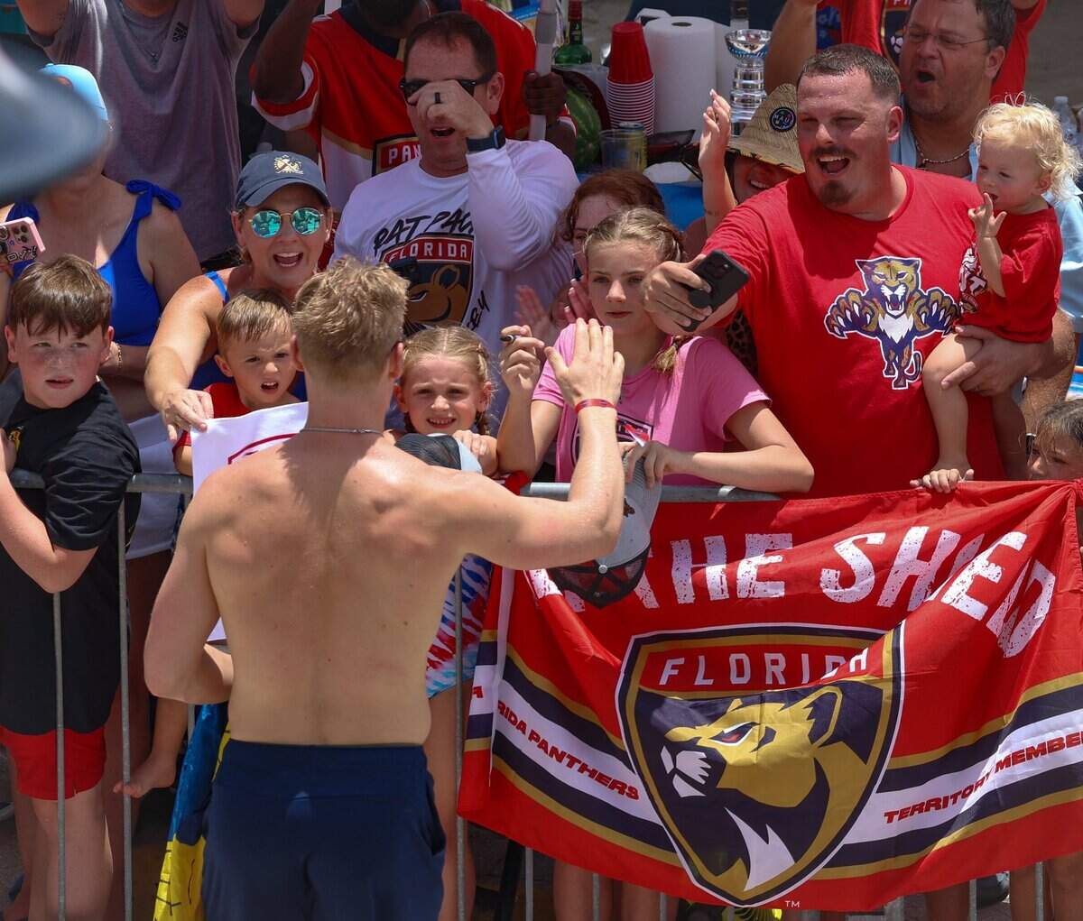 Florida Panthers defenseman Gustav Forsling greets fans on A1A just north of the staging area for the Florida Panthers Stanley Cup championship celebration parade on Sunday, June 22, 2025 in Fort Lauderdale, Florida.