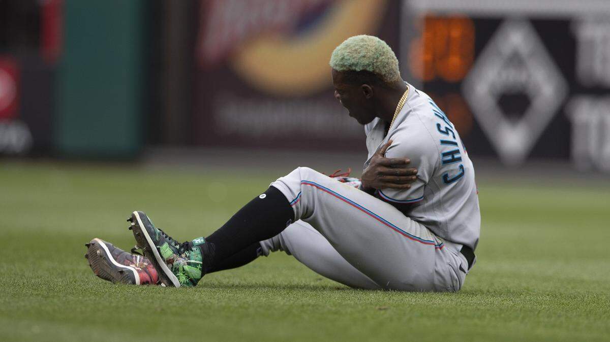PHILADELPHIA, PA - JULY 18: Jazz Chisholm Jr. #2 of the Miami Marlins reacts after an injury in the bottom of the first inning against the Philadelphia Phillies at Citizens Bank Park on July 18, 2021 in Philadelphia, Pennsylvania. (Photo by Mitchell Leff/Getty Images)