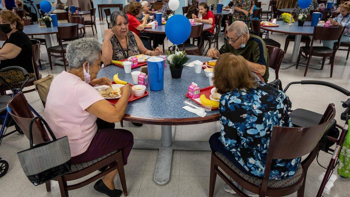 Residents at Carroll Manor Senior Center, 3667 South Miami Ave., enjoy lunch in the dining room upon reopening May 25, 2021, after being closed during the pandemic. This is part of the Little Havana Nutrition chain. Gov. Ron DeSantis vetoed a $1 million project for the chain from the 2022-23 state budget.