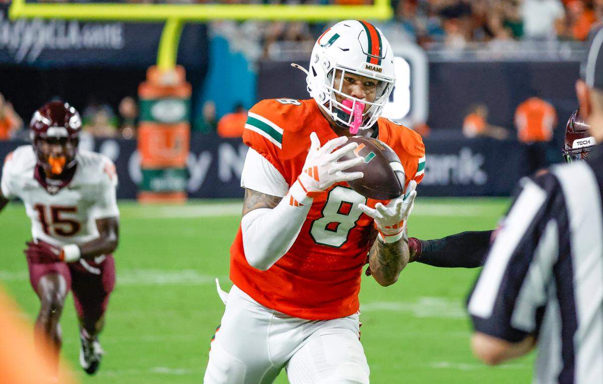 Miami Hurricanes tight end Elijah Arroyo (8) on a long pass reception against the Virginia Tech Hokies during the first half of an ACC conference football game at Hard Rock Stadium on Friday, September 27, 2024, in Miami Gardens, Fla.